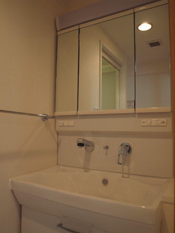 Wash basin, toilet. Vanity wide type of new.