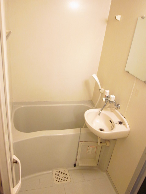 Bath. Unit bath with a wash bowl