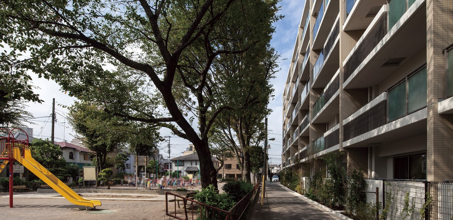 Building exterior that looks to the green over the park