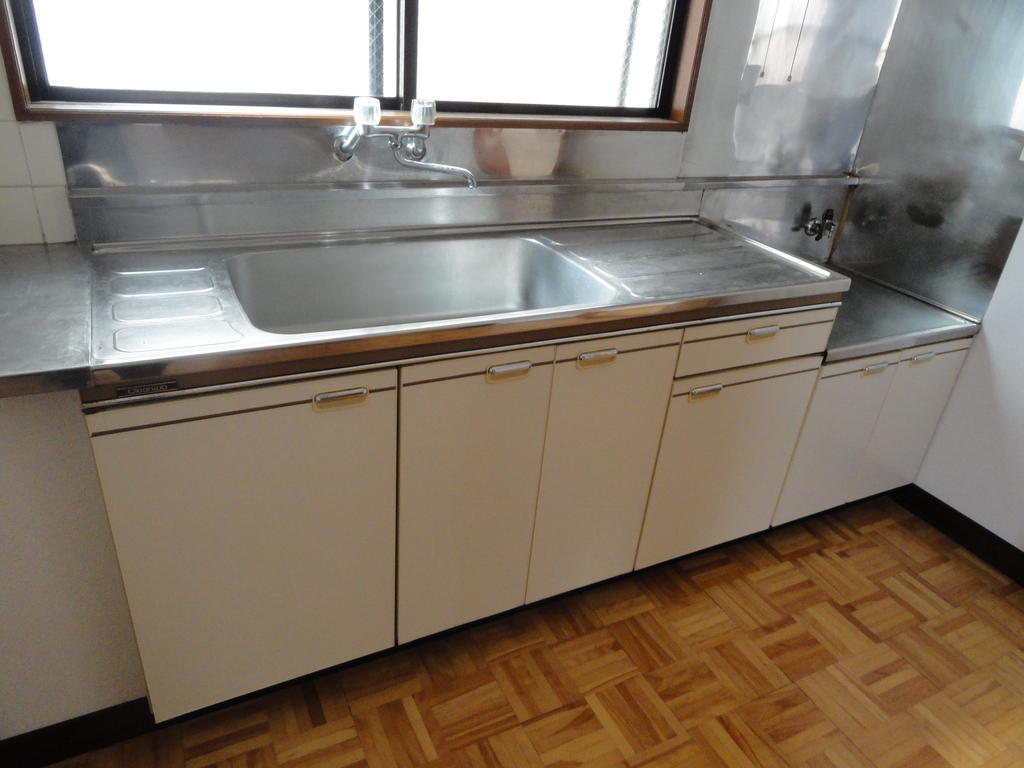 Kitchen. With a window is bright kitchen.