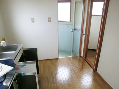 Other room space. Kitchen space of the room.