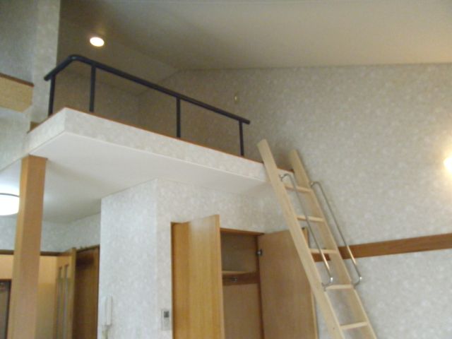 Living and room. Because there is a loft, Also points there is a ceiling is high and airy.