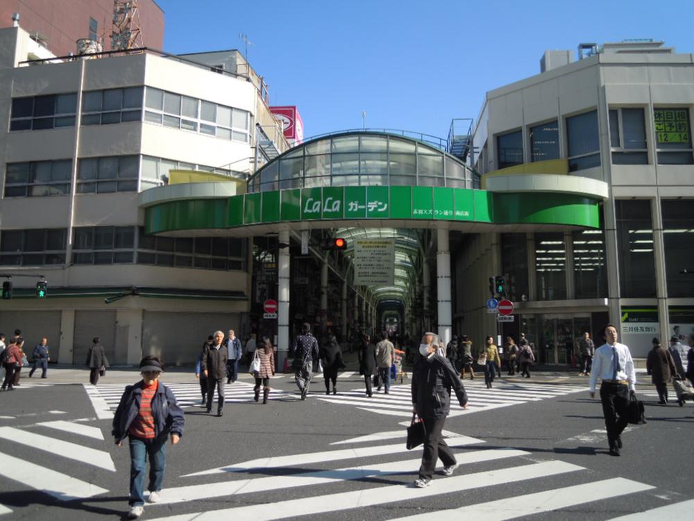 Other. Is in front of the station there is a shopping street with a arcade "LaLa Garden".