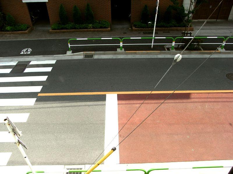 View photos from the dwelling unit. It is a road with a firm development has been the sidewalk you can see and overlooking the lower from balcony.