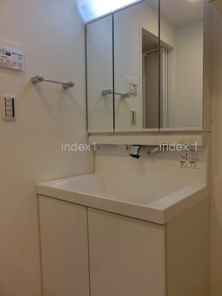 Wash basin, toilet. Wash basin is a handy shower faucet!