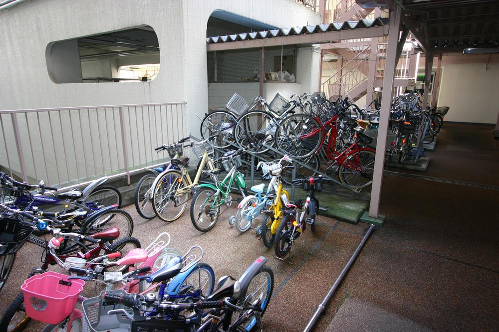 Other common areas. Elevator near a children's bicycle parking space.