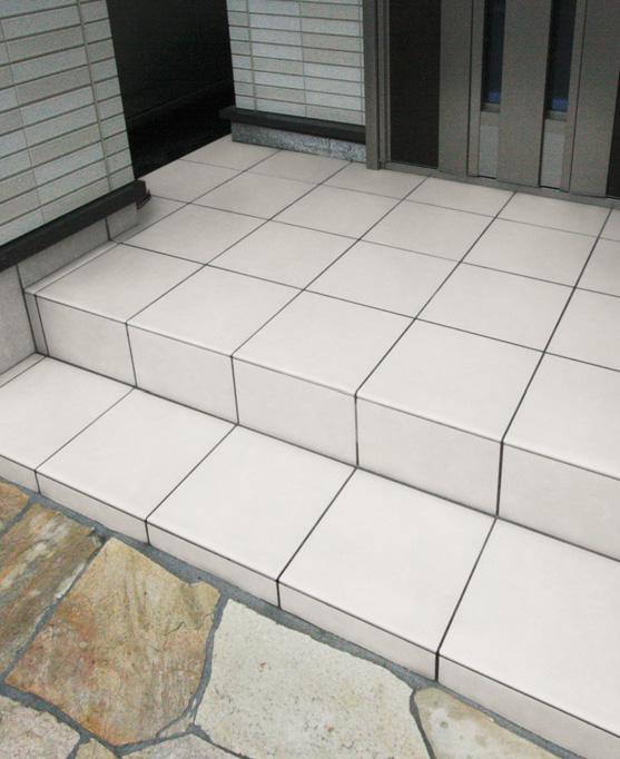 Other Equipment. Entrance porch tiles have been arranged to match the color of the outer wall. It has become a bright finish worthy of the place to welcome the return of the family. 