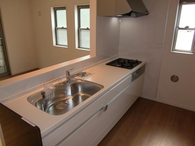 Kitchen. It is an open type of face-to-face kitchen.