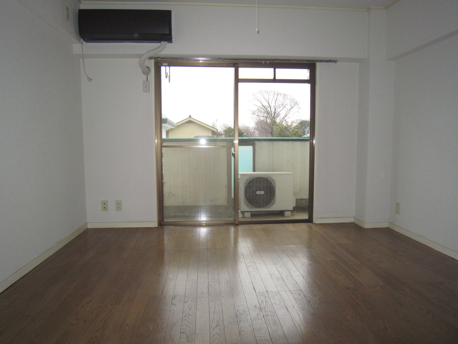 Living and room. Room is glad flooring clad Western-style