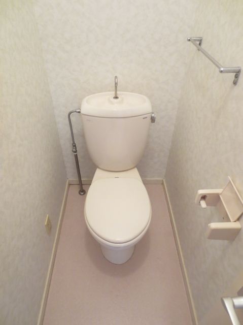 Toilet. Toilet with a clean feeling with a towel hanger.
