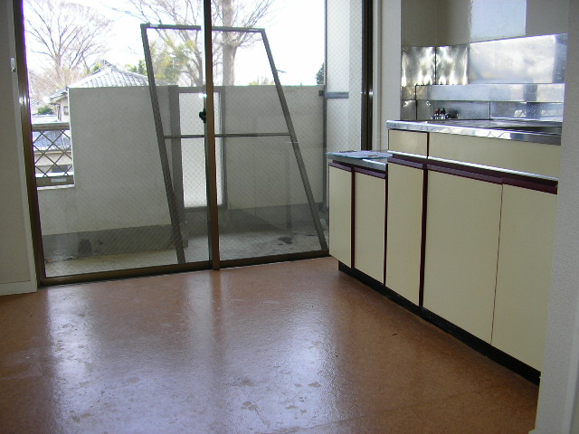 Living and room. Large windows that are out on the veranda. Bright kitchen