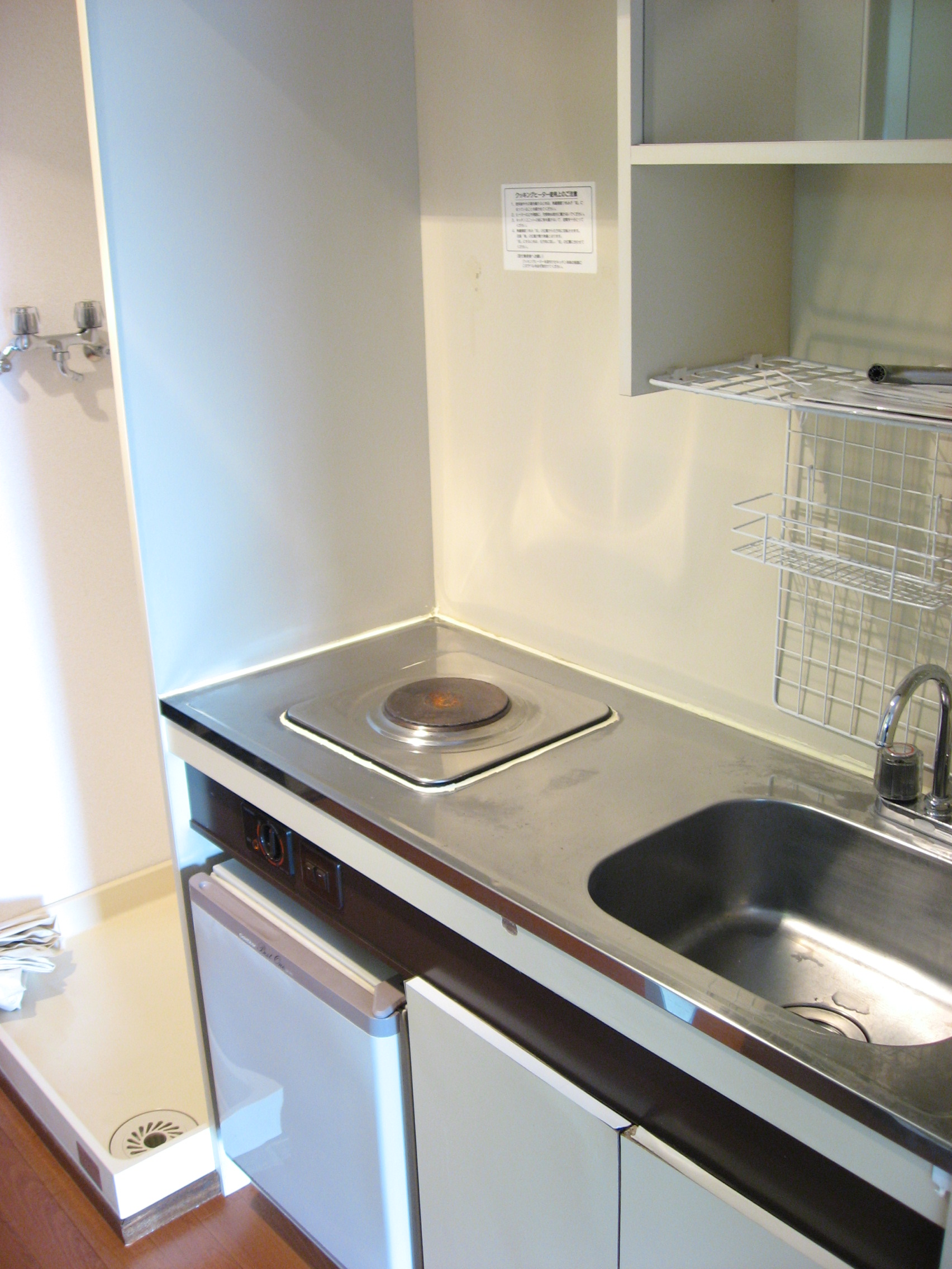 Kitchen. It is a compact kitchen! There is a mini-fridge at the bottom!