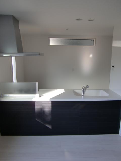 Kitchen. It is an open kitchen for the cafe style. There is also a lighting window in the rear and side.