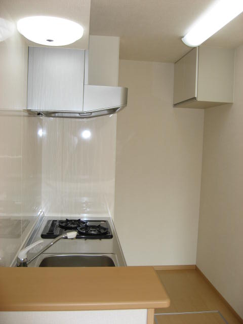 Kitchen. Looking at the kitchen from the side ・ ・ ・ . It is with a convenient counter.