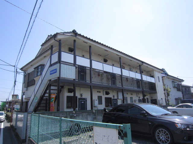 Building appearance. It is a dark street at night also safe because the big street along a