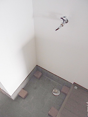 Other room space. Washing machine in the room