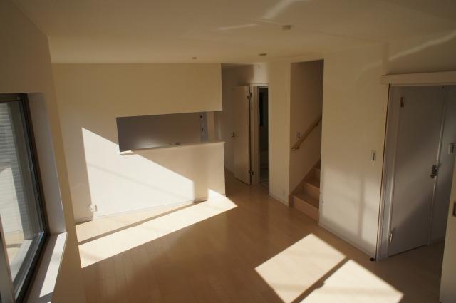 Living. Counter kitchen and living access stairs