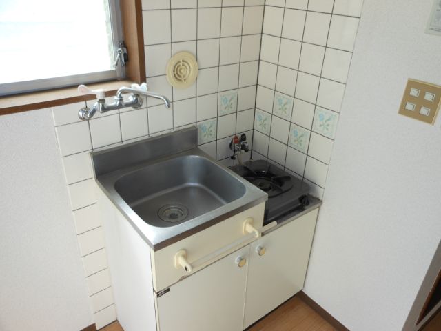 Kitchen. Bright and there is a window kitchen