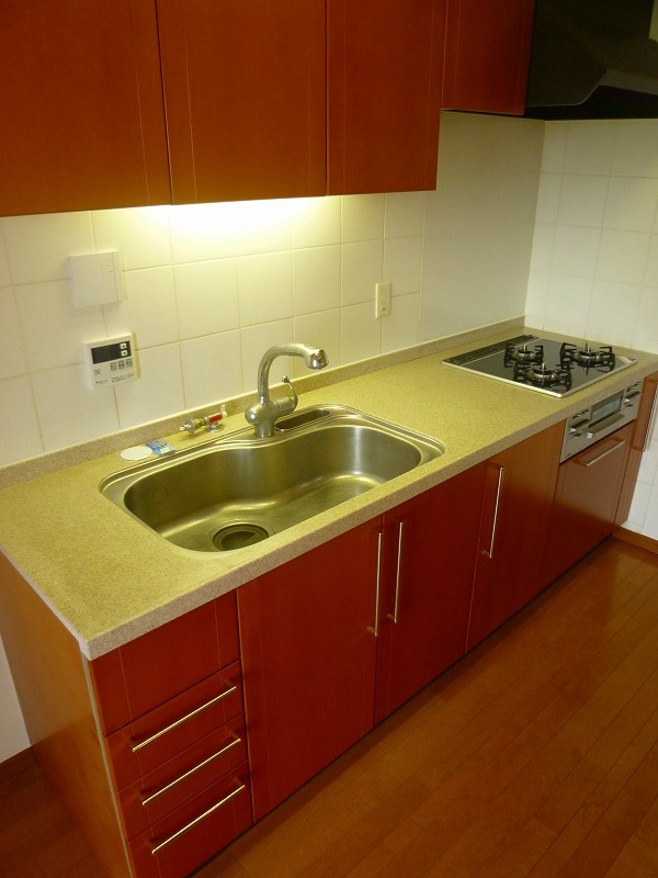 Kitchen. The photograph is a different Room No..