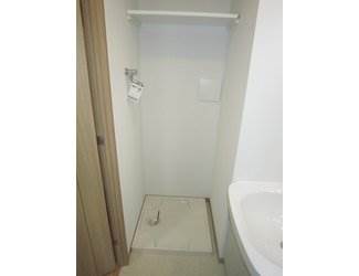 Other room space. Washing machine in the room