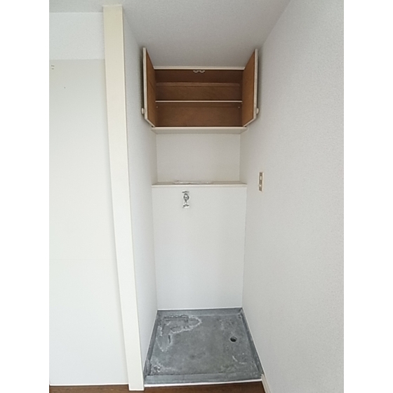 Other Equipment. Washing machine in the room and an upper storage