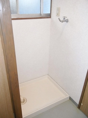 Washroom. Washing machine in the room