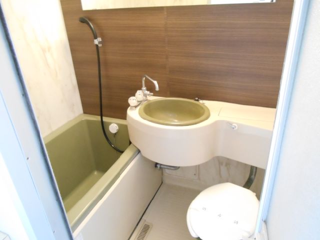 Bath. Stylish unit bus with wide mirror on the panel of brown