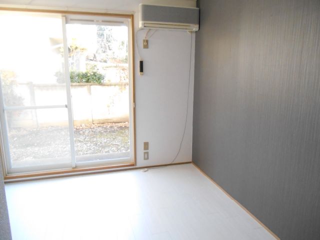 Living and room. Stylish room with a black accent cross on a white floor