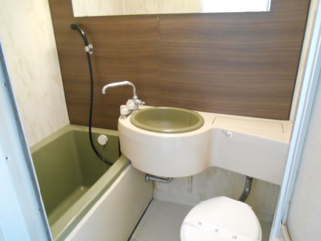 Bath. Stylish unit bus with wide mirror on the panel of brown