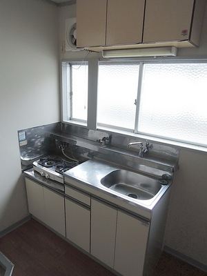Kitchen. Two-burner gas stove installed base kitchen