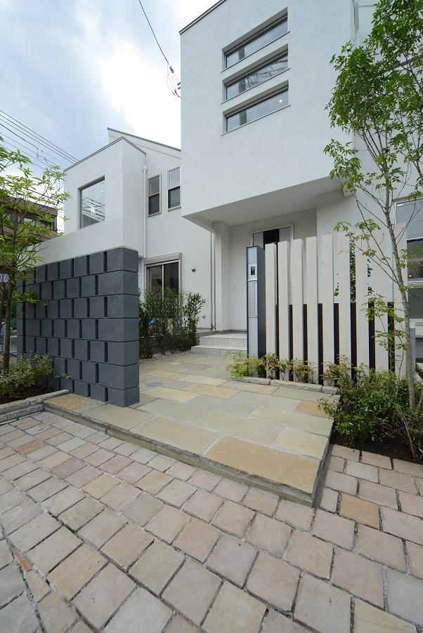 Local appearance photo. The subject property will be on the left side of the screen. At night, Us with clean choreographed appearance flooded with light from the window.