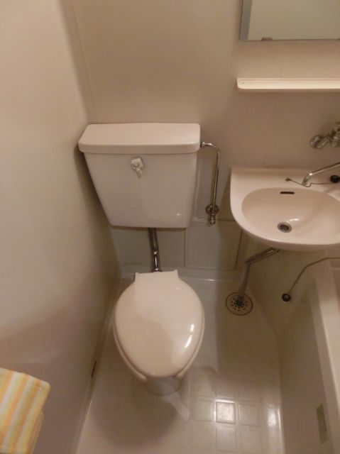 Toilet. Toilet next to the bath