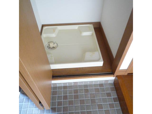 Other Equipment. Washing machine in the room of the door with