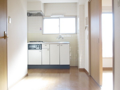 Other room space. There is a window in the kitchen