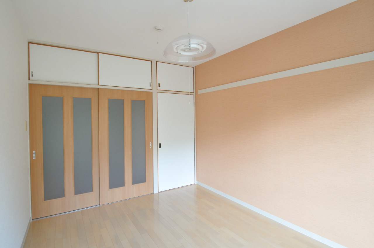 Living and room. One side is a cross-covered bright rooms of color.