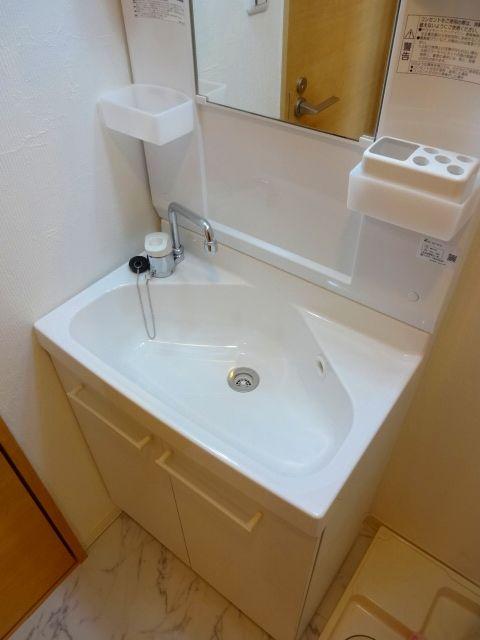 Wash basin, toilet. Bathroom vanity