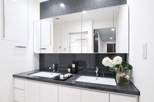 Vanity double bowl specification. Beautiful marble has been subjected to the counter and the front of the wall. The vanity of the side is reserved also linen cabinet with depth.