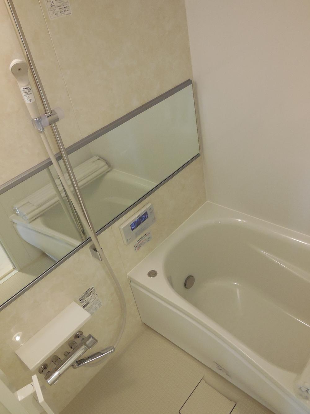 Bathroom. Bathroom with a feeling of luxury with a long mirror. Also it comes with of course bathroom ventilation drying heater