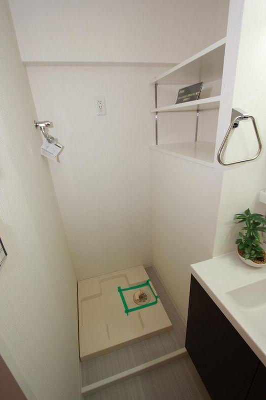 Wash basin, toilet. Washing machine Storage