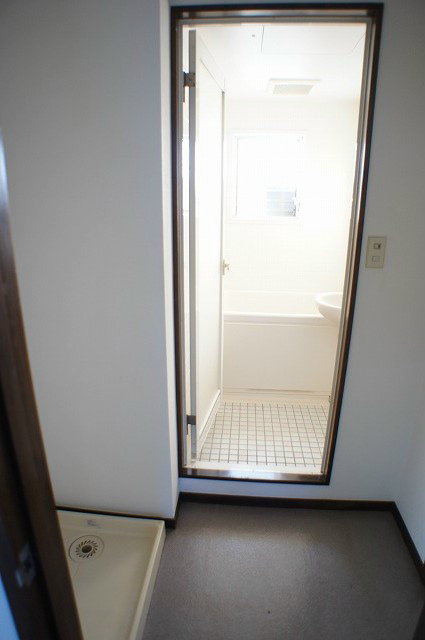 Other Equipment. Washing machine in the room ~ Bathroom door