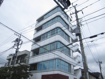 Building appearance. Beautiful apartment of the entire surface of the glass