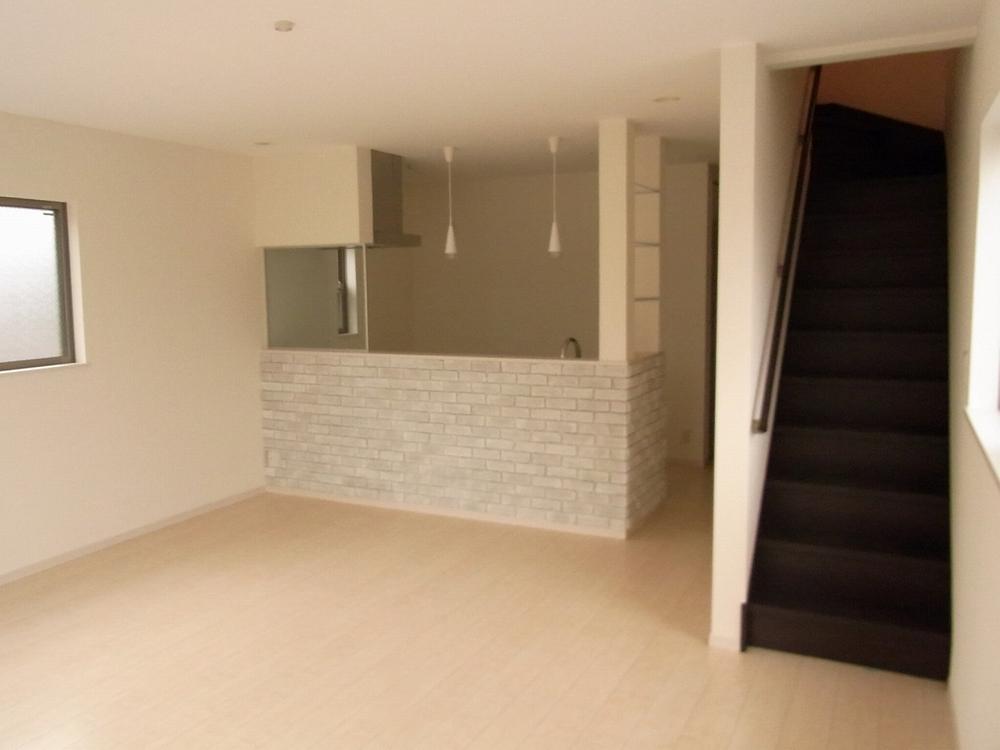 Living. Counter kitchen and living access stairs