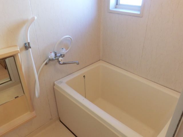 Bath. There is also a spacious bath is a ne window was