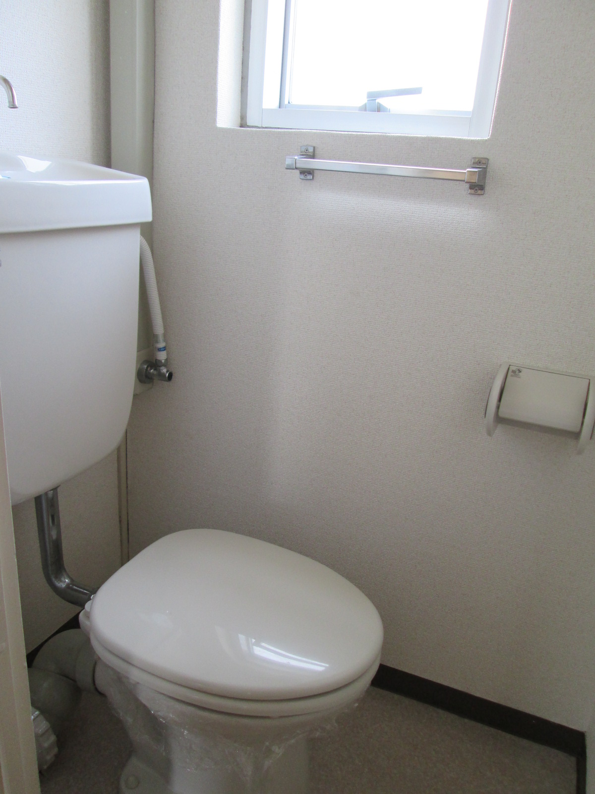 Toilet. Bright window with a toilet. Also it comes with an electrical outlet.