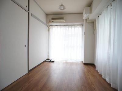 Living and room. It is a bright room with southwestward