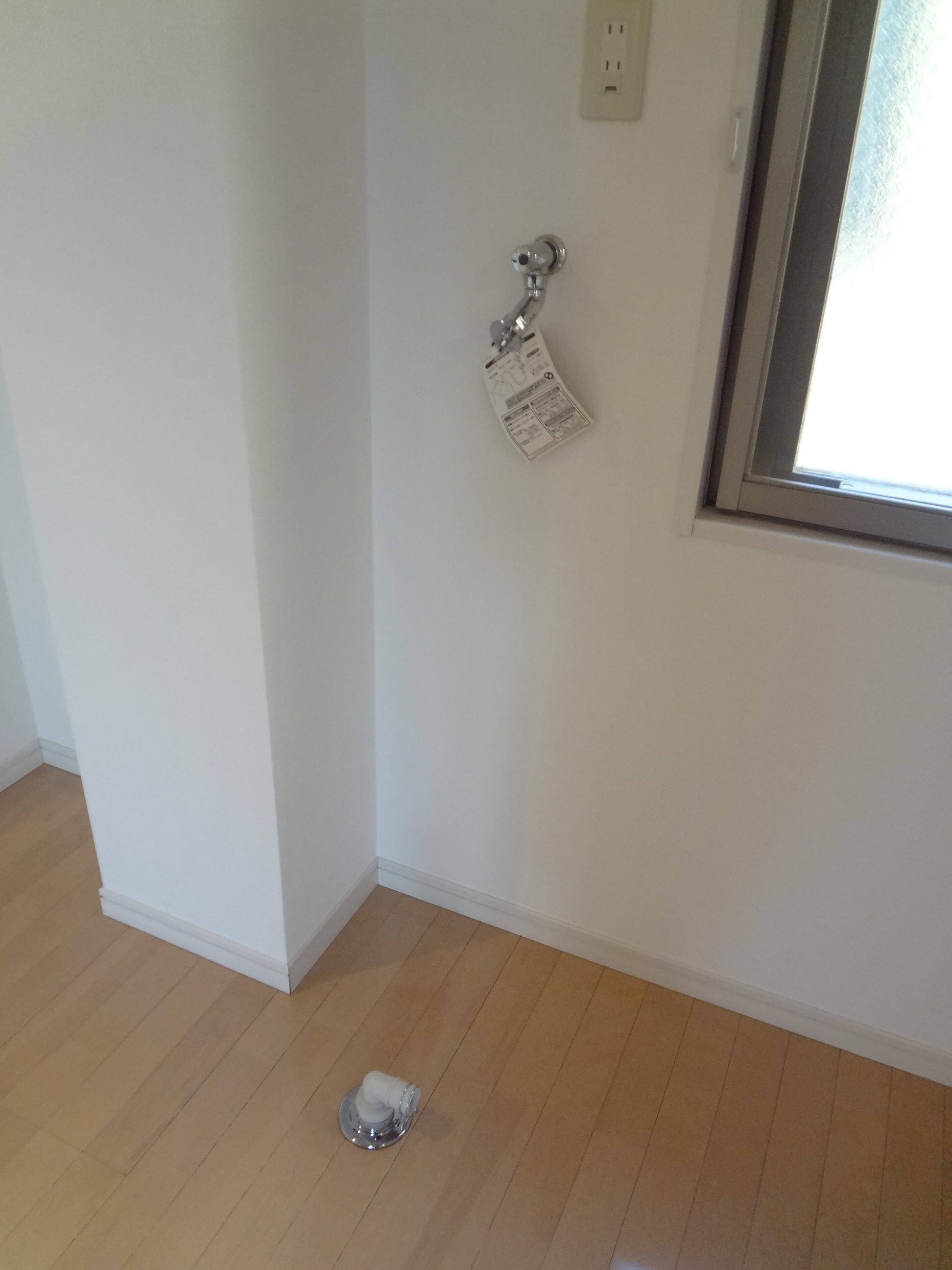 Washroom. Washing machine in the room