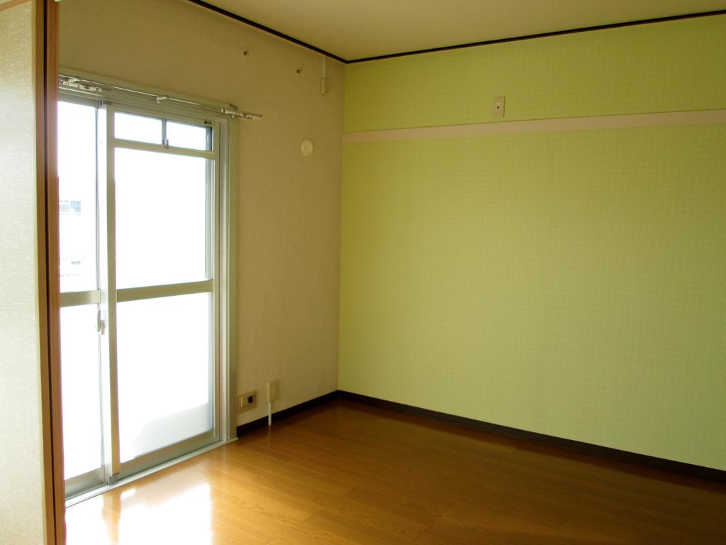 Living and room. Directing the bright Western-style lime green wallpaper