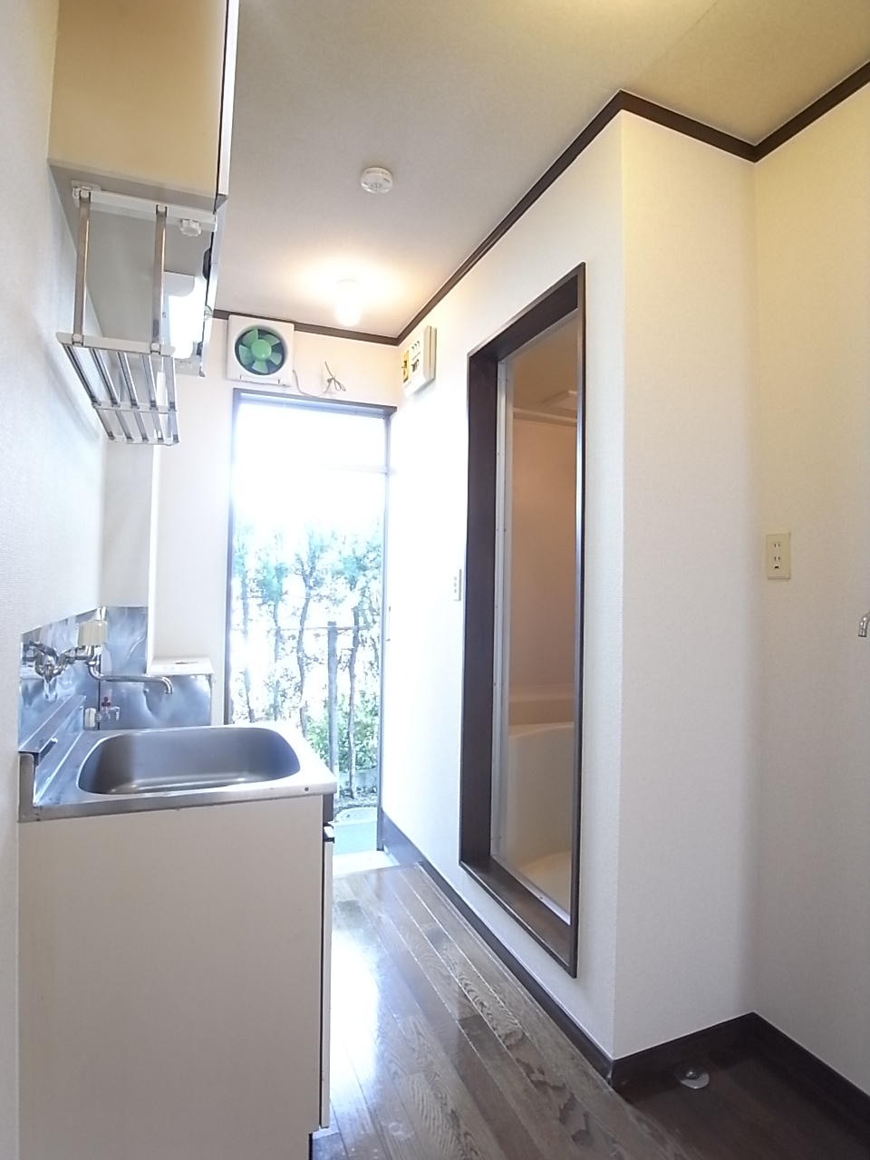 Other room space. Washing machine storage and water around