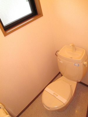 Toilet. There is a window in the toilet