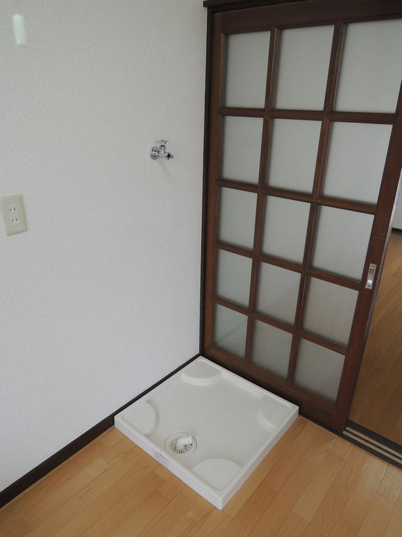 Other room space. Washing machine in the room